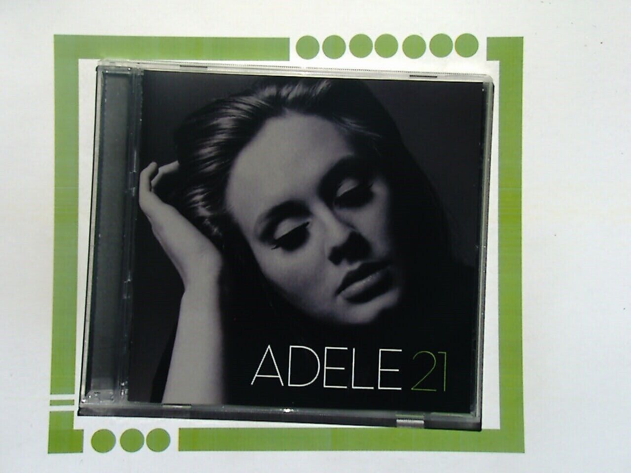 Bookandbeat.com CD: Adele - 21, Pop Music, Grammy Award-Winning Album, Sophomore Studio Release, Soulful Vocals, Emotional Ballads, Chart-Topping Hits, Personal Themes, Production by Rick Rubin and Paul Epworth, Iconic Tracks, "Rolling in the Deep," "Someone Like You," "Set Fire to the Rain," Heartfelt Lyrics, Powerful Storytelling, Contemporary Sound, Cultural Impact, Critical Acclaim, Multi-Platinum Sales, Influential Artist, Essential Listening for Music Lovers, Richly Arranged, Timeless Classics, Music