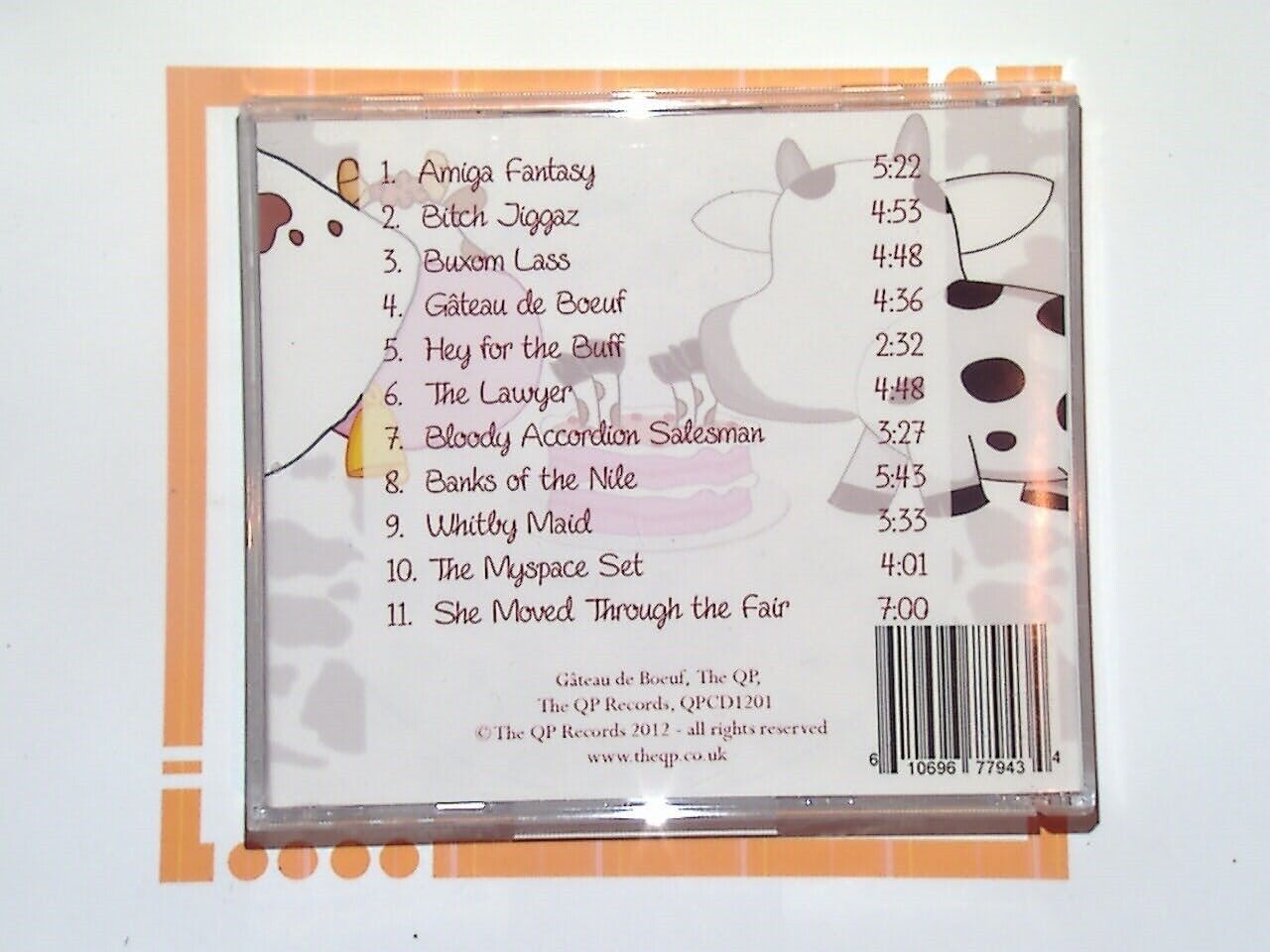 Bookandbeat.com, The QP, Gateau de Boeuf, CD, Experimental Music, Avant-Garde, Indie, Alternative, Unique Sound, Electronic Beats, Fusion Music, Rare Album, Mint Condition, Music Collectors, Underground Music, Innovative Soundscapes,