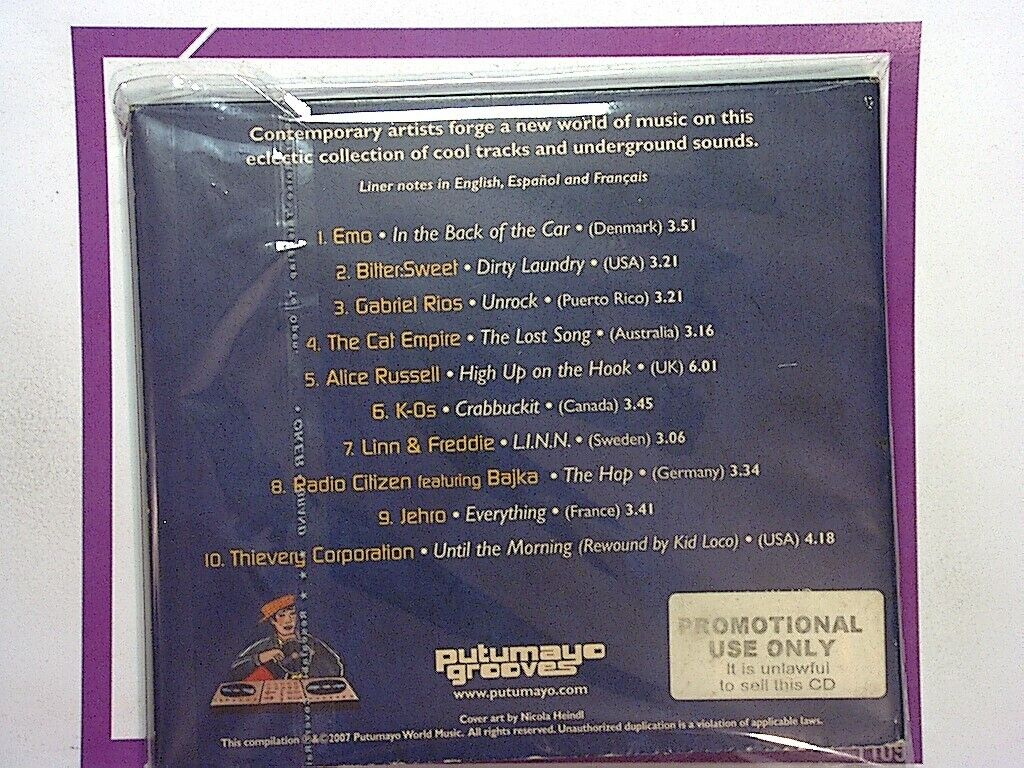 Putmayo Presents	A New Groove Promo CD VGC