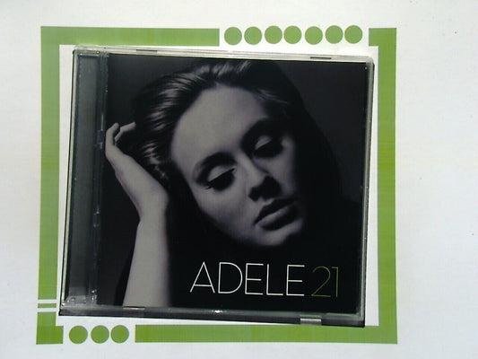 Bookandbeat.com CD: Adele - 21, Pop Music, Grammy Award-Winning Album, Sophomore Studio Release, Soulful Vocals, Emotional Ballads, Chart-Topping Hits, Personal Themes, Production by Rick Rubin and Paul Epworth, Iconic Tracks, "Rolling in the Deep," "Someone Like You," "Set Fire to the Rain," Heartfelt Lyrics, Powerful Storytelling, Contemporary Sound, Cultural Impact, Critical Acclaim, Multi-Platinum Sales, Influential Artist, Essential Listening for Music Lovers, Richly Arranged, Timeless Classics, Music 