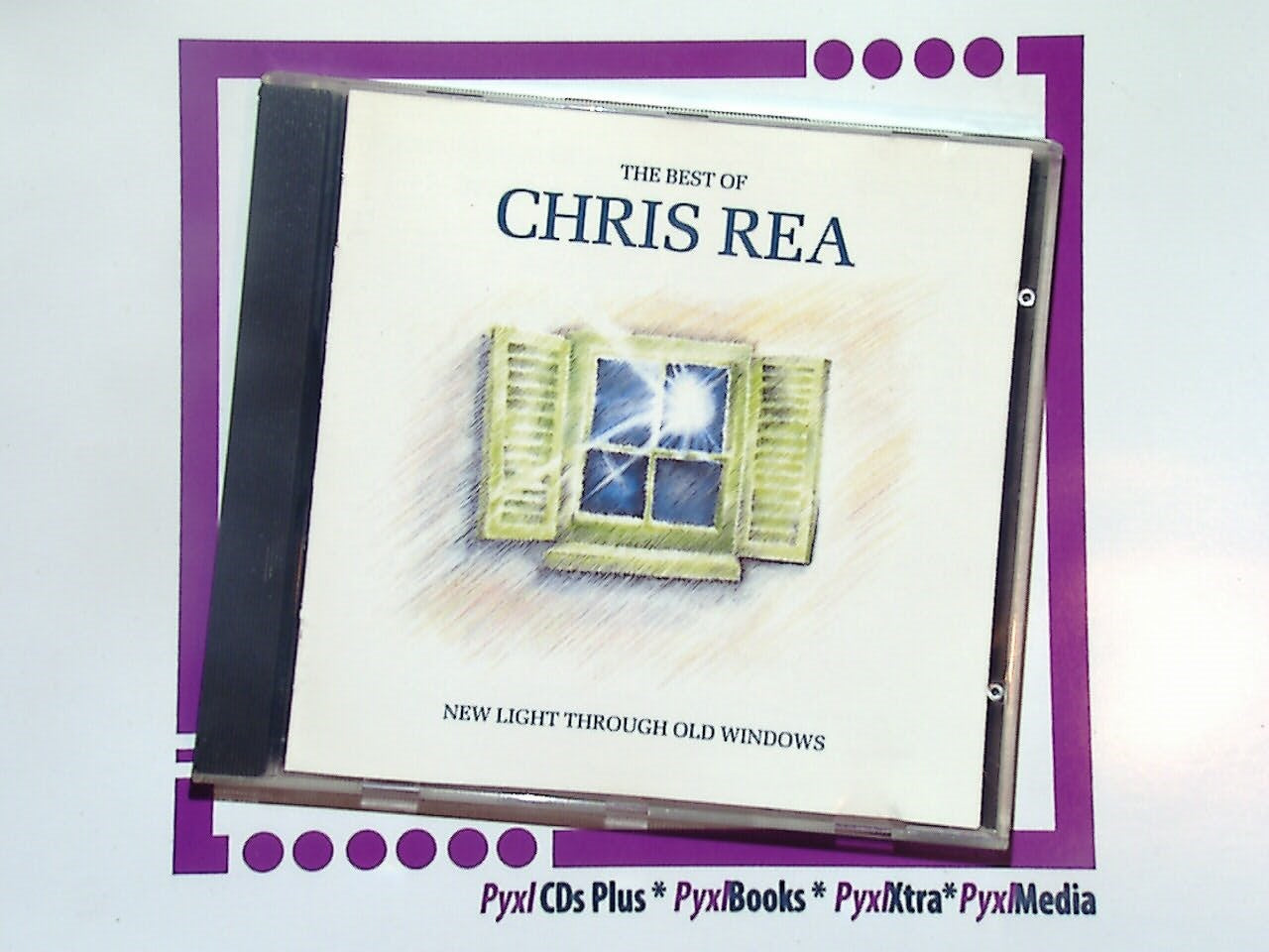Chris Rea, The Best of Chris Rea, New Light Through Old Windows, Chris Rea CD, classic rock, blues rock, singer-songwriter, best of album, soft rock, smooth vocals, guitar-driven music, 80s music, hits compilation, nostalgic music, British artist, album collection, Bookandbeat.com, timeless classics, emotive lyrics, guitar ballads, heartfelt songs, classic hits.