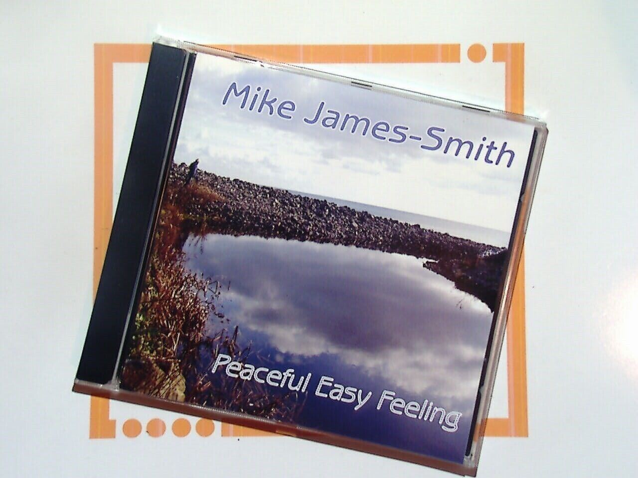 bookandbeat.com, CD, Mike James-Smith, Peaceful Easy Feeling, easy listening, relaxing music, smooth melodies, mellow tunes, peaceful ambiance, calming soundscapes, acoustic arrangements, soulful performance, reflective music, uplifting tracks, gentle rhythms, soothing vocals, chill-out album, serene vibes, timeless classics, heartfelt lyrics, music for relaxation, feel-good songs.