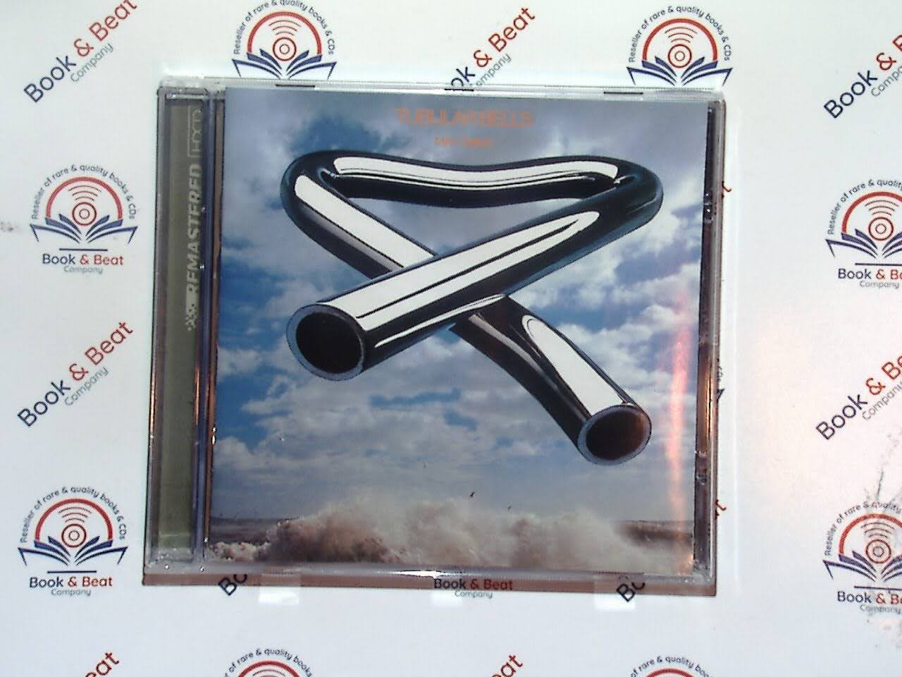 Mike Oldfield, Tubular Bells, Progressive Rock, 1970s Music, Instrumental, Classic Album, Iconic Sound, Experimental Rock, Ambient Music, Virgin Records, Timeless Classic, Legendary Artist, Collector's Item, VGC CD, Bookandbeat.com,new CDs, used CDs, new books, used books, online music store, online bookstore, rare CDs, rare books, affordable books, affordable CDs, book lovers, music enthusiasts, collectible CDs, vintage books,DVD,