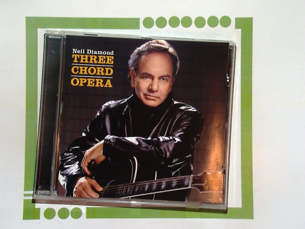 bookandbeat.com, Neil Diamond, Three Chord Opera, singer-songwriter, classic pop, Neil Diamond album, ballads, soft rock, 2000s music, iconic artist, heartfelt lyrics, legendary performer, contemporary pop.