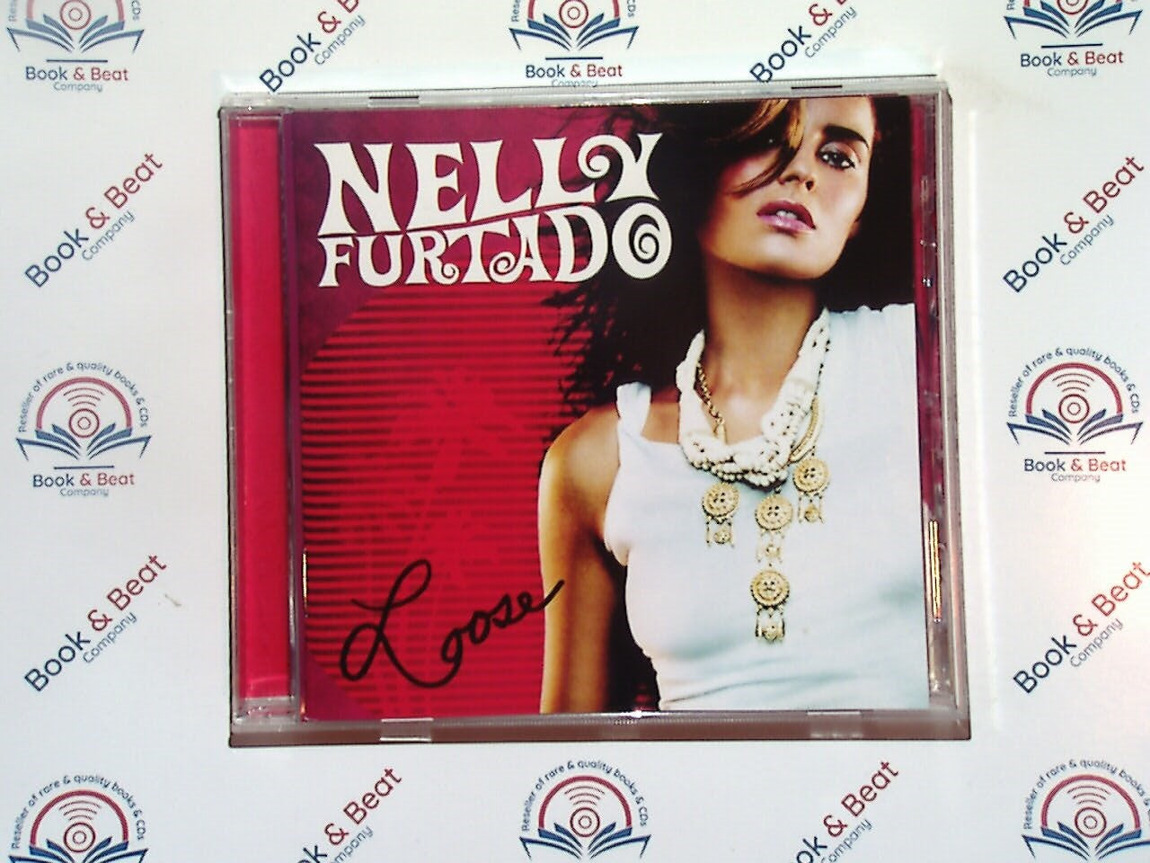 Nelly Furtado, Loose, pop music, R&B, hip-hop influences, 2000s hits, Timbaland production, Say It Right, Promiscuous, Maneater, chart-topping album, dance-pop, Canadian artist, hit singles, Grammy-nominated, best-selling album, bookandbeat.com,new CDs, used CDs, new books, used books, online music store, online bookstore, rare CDs, rare books, affordable books, affordable CDs, book lovers, music enthusiasts, collectible CDs, vintage books,DVD,