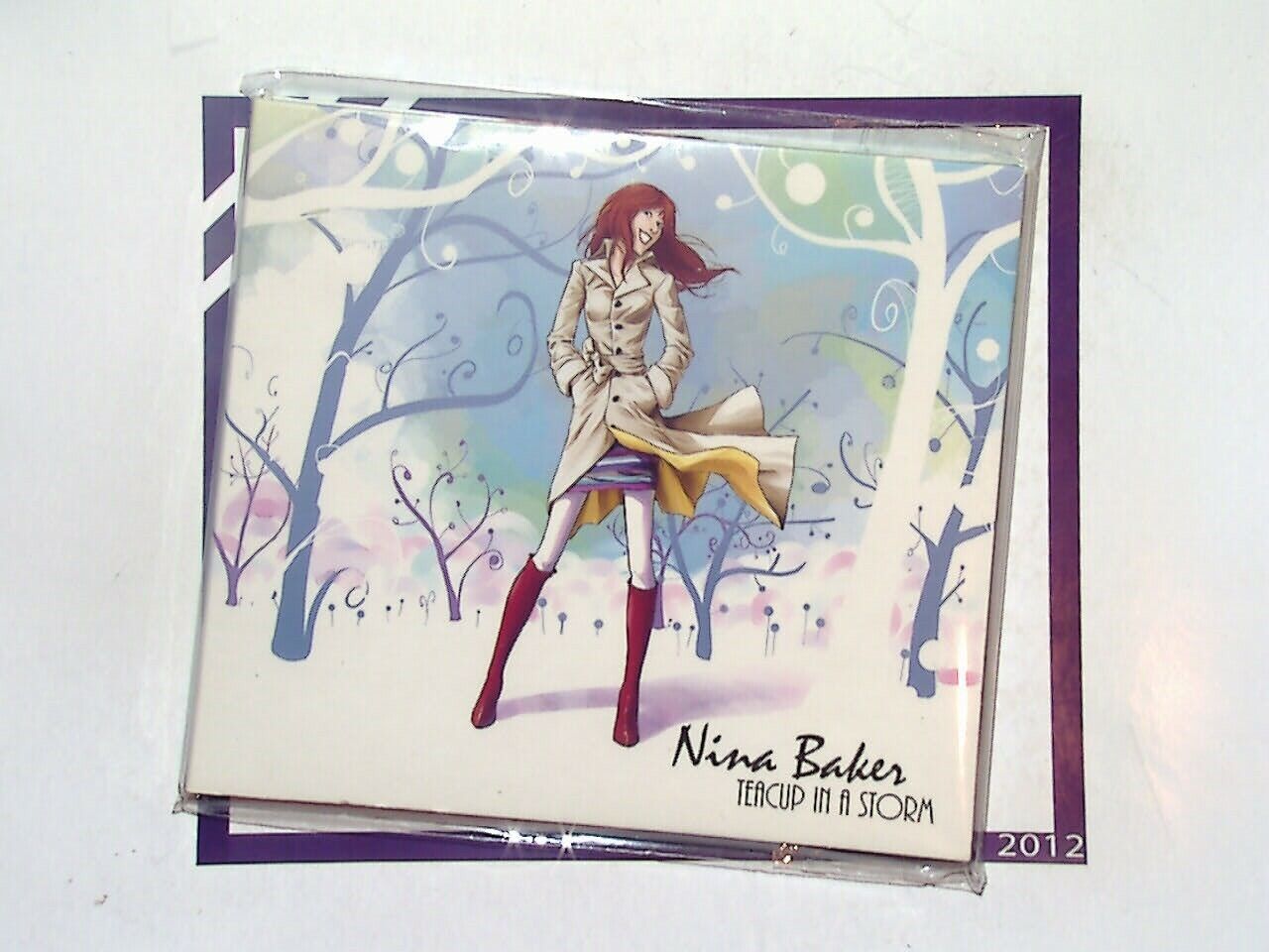 bookandbeat.com, Nina Baker, Teacup In A Storm, singer-songwriter, soulful vocals, contemporary jazz, British artist, heartfelt lyrics, emotive music, piano-driven, smooth jazz, storytelling, introspective, powerful ballads, unique voice, soft pop, acoustic style, melodic tunes, jazz-pop blend, independent artist, bookandbeat.com music.