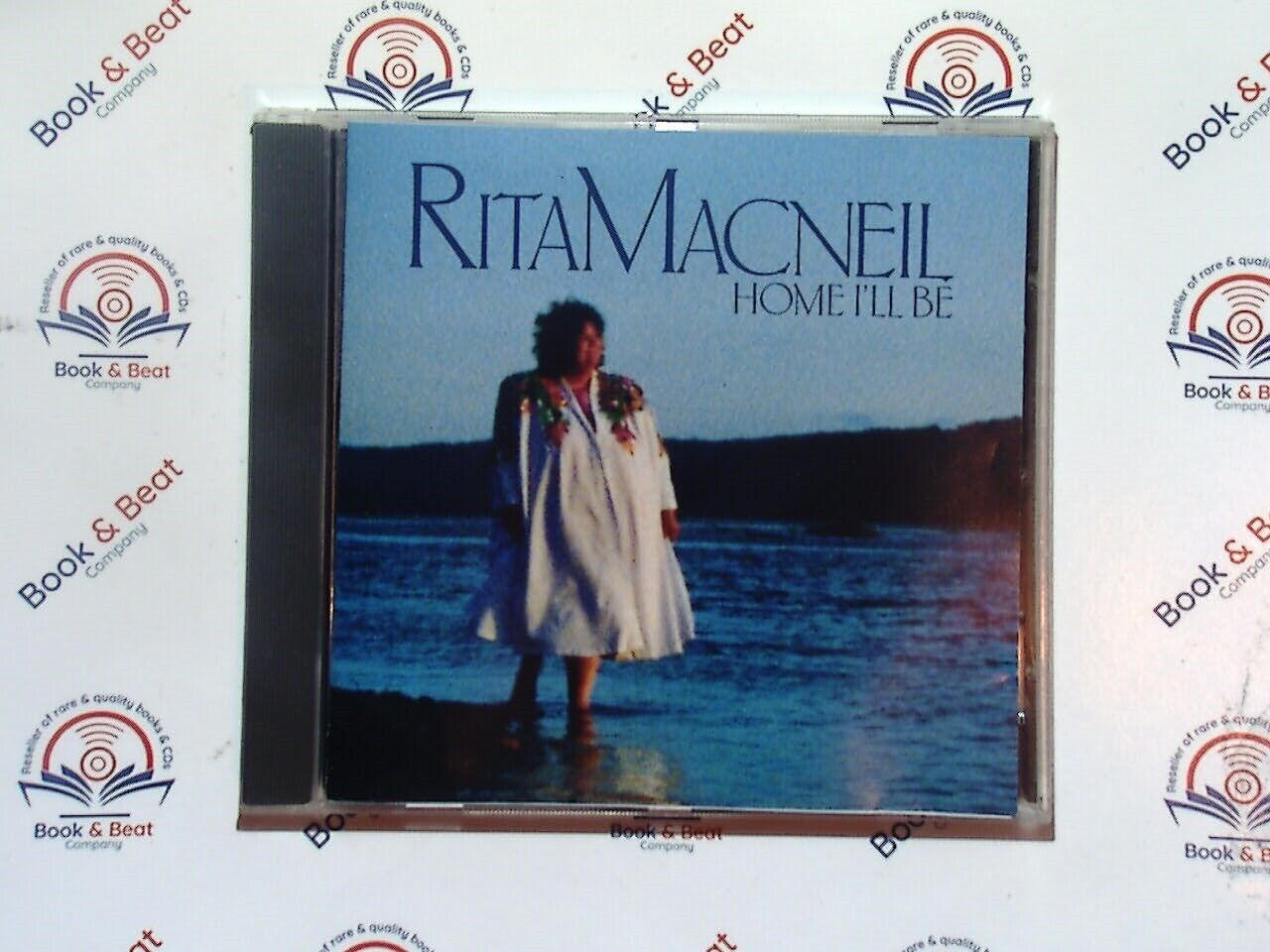 bookandbeat.com, Rita MacNeil, Home I'll Be, folk music, Canadian artist, heartfelt songs, traditional music, soothing vocals, classic folk, storytelling through music, timeless melodies, emotional lyrics, acoustic arrangements, folk ballads, iconic Canadian singer.