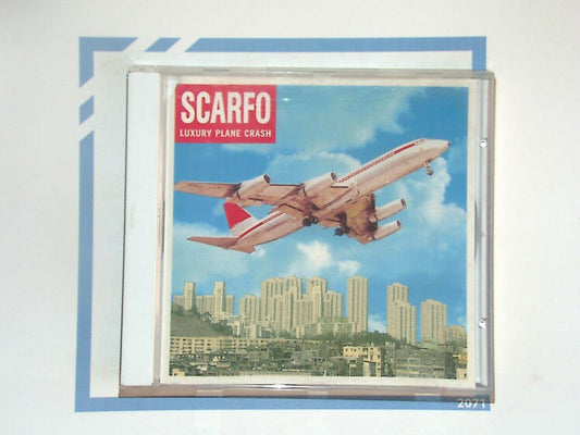 bookandbeat.com, Scarfo, Luxury Planecrash, alternative rock, indie punk, British rock, edgy sound, grunge influence, 90s alternative, high energy, raw guitar, powerful lyrics, underground rock, youthful energy, punk spirit, dark themes, rebellious music, bookandbeat.com music.