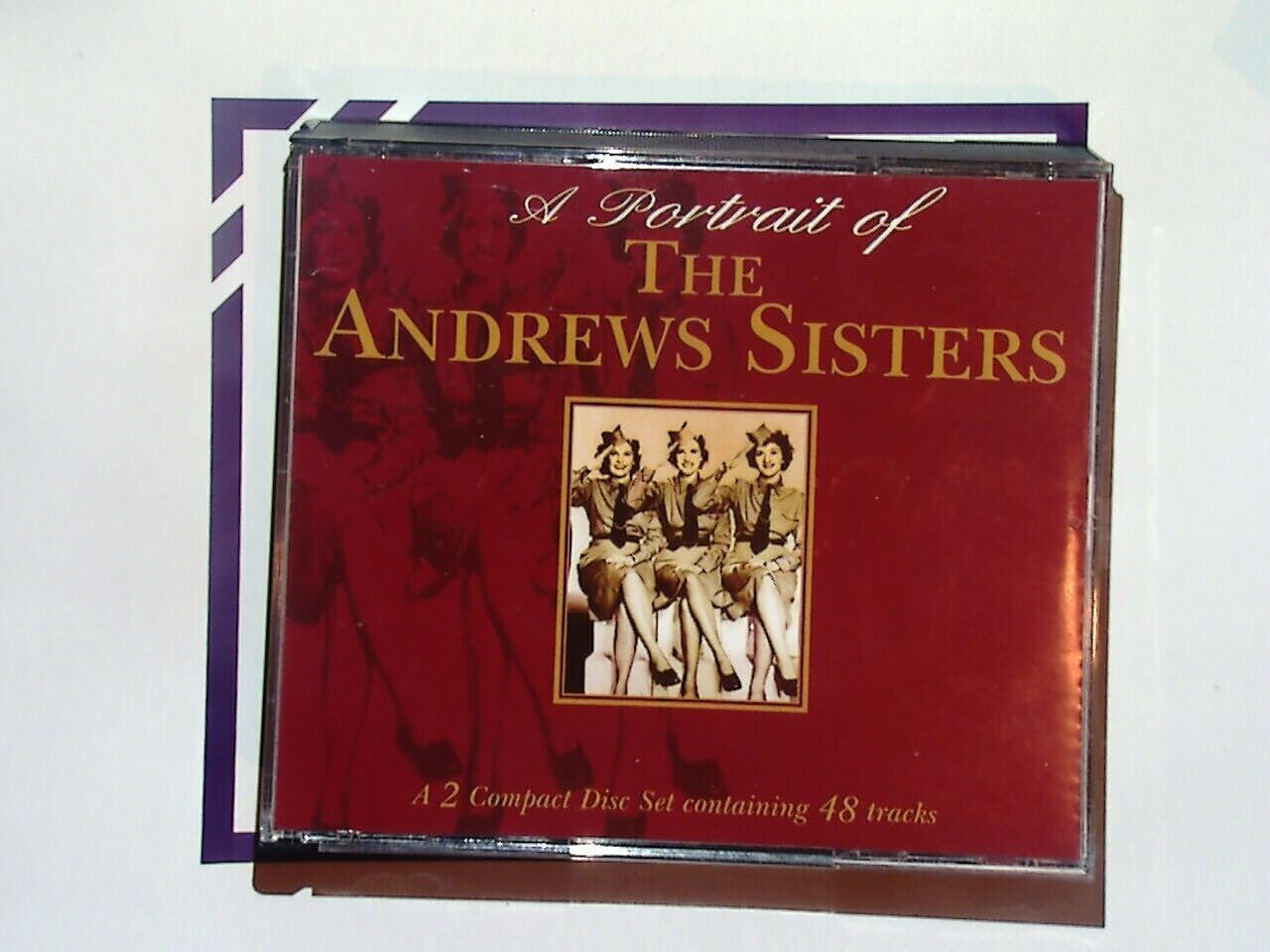 bookandbeat.com, The Andrews Sisters, portrait album, vocal trio, classic hits, swing music, jazz, 1940s music, nostalgia, popular music, wartime songs, female vocalists, harmony, American music, music collection, retro music, vintage sounds, musical legends, pop standards, bookandbeat.com music.
