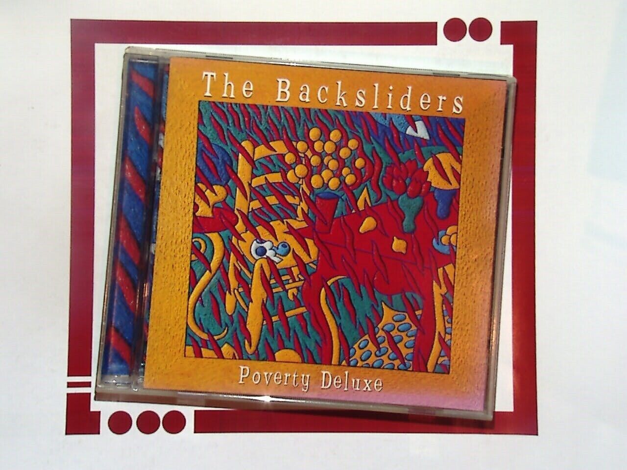 The Backsliders, Poverty Deluxe, CD, Bookandbeat.com, Blues rock, Americana, Roots music, Slide guitar, Rockabilly, Southern rock, Folk influences, Indie music, Guitar-driven, Soulful vocals, Raw sound, Classic blues, American roots, Contemporary blues, Acoustic elements, Gritty sound, Retro vibes, Alternative rock,