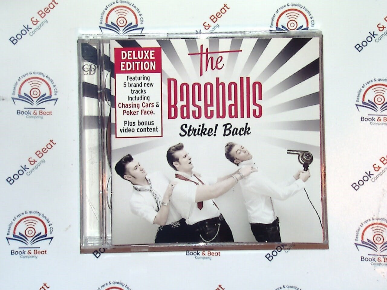 The Baseballs, Strike! Back, rock 'n' roll, rockabilly, cover songs, retro style, 50s revival, modern hits with vintage sound, energetic performance, German band, classic rock influence, upbeat music, vocal harmonies, fun party music, unique covers, bookandbeat.com,new CDs, used CDs, new books, used books, online music store, online bookstore, rare CDs, rare books, affordable books, affordable CDs, book lovers, music enthusiasts, collectible CDs, vintage books,DVD,