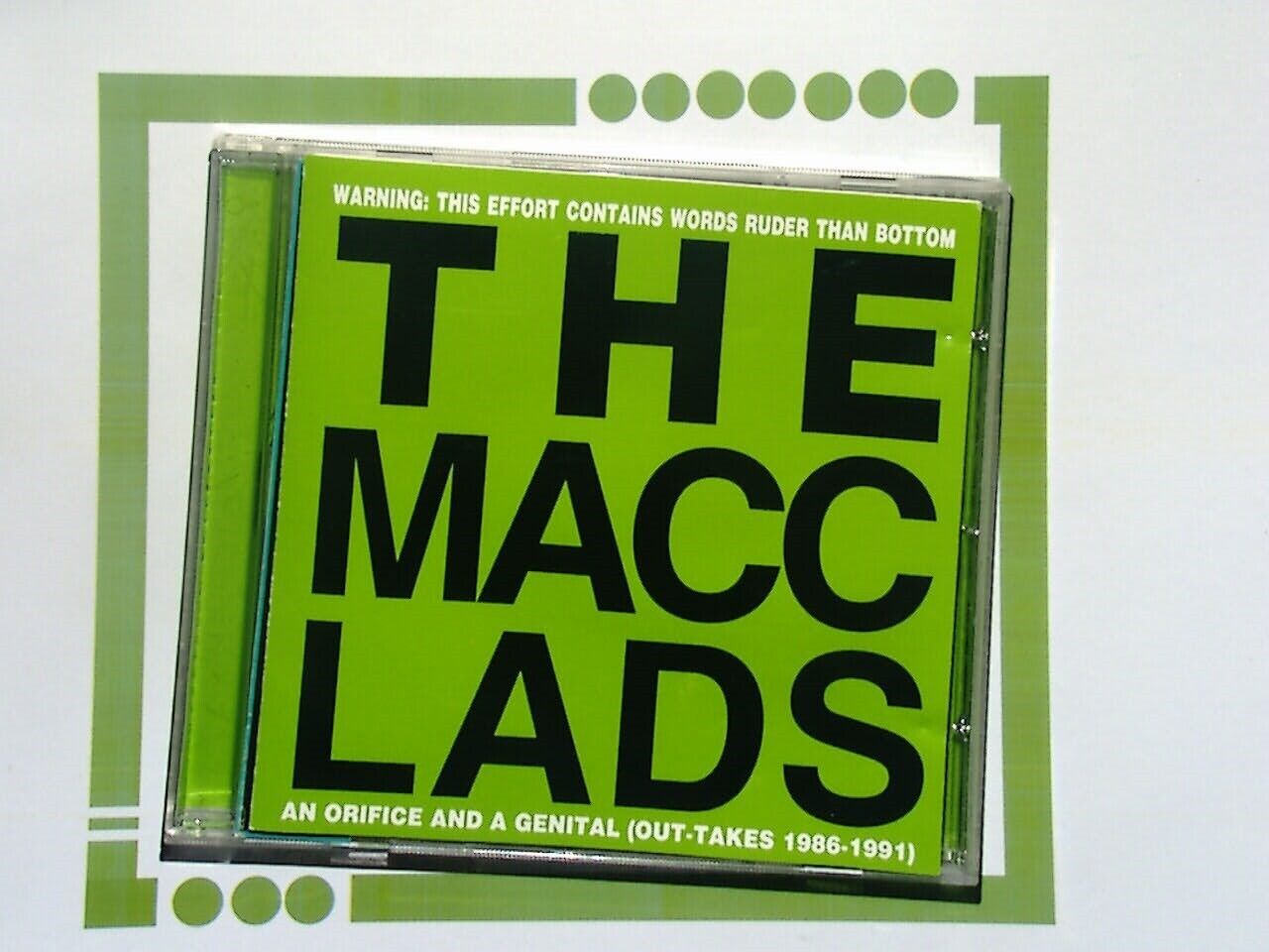 The Macc Lads, An Orifice And A Genital, Punk Rock, Comedy Rock, British Punk, Satirical Lyrics, Crude Humor, 80s Punk, Offensive Comedy, Controversial Music, British Band, Underground Punk, Provocative Lyrics, Alternative Rock, Hardcore Punk, Rebel Music, Punk Satire, UK Punk Scene, Punk Anthems, Bookandbeat.com,