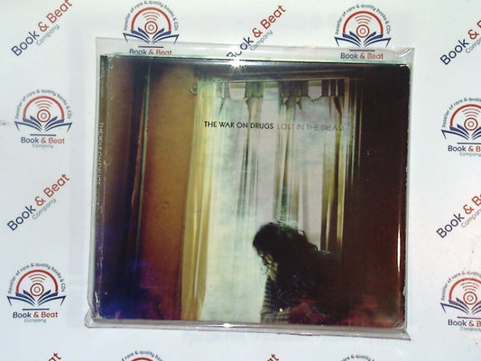 bookandbeat.com, CD, rock music, indie rock, alternative rock, The War On Drugs, Lost In The Dream, music album, 2010s music, American rock, lyrical depth, atmospheric sound, guitar-driven, vinyl sound, musical journey, introspective lyrics, modern rock, critically acclaimed, album of the year, music collection,