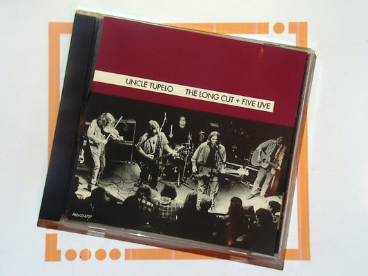 Uncle Tupelo, The Long Cut, Five Live, Alternative Country, Alt-Country, Live Performances, Americana, Roots Rock, Country Rock, Folk Rock, Indie Rock, 90s Rock, Acoustic Sessions, Live Album, Raw Sound, Classic Tracks, Country Influences, Midwest Rock, Alt-Rock Legends, Bookandbeat.com,