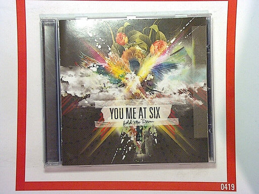 bookandbeat.com, CD, You Me at Six, Hold Me Down, alternative rock, pop punk, British band, fan favorite, catchy melodies, emotional lyrics, guitar-driven, energetic album, passionate vocals, introspective themes, high-energy, anthem tracks, iconic songs, popular release, youthful rebellion, intense sound, Mint condition, memorable hooks, influential album
