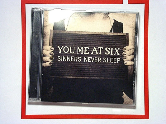 bookandbeat.com, CD, You Me at Six, Sinners Never Sleep, alternative rock, pop punk, post-hardcore, British band, energetic album, emotional lyrics, rock anthems, catchy choruses, fan favorite, intense sound, popular release, high energy, powerful vocals, guitar-driven, alternative music, raw emotions, rebellious themes, iconic tracks, influential album