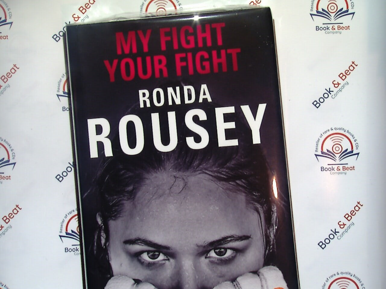 Ronda Rousey, My Fight Your Fight, autobiography, MMA, mixed martial arts, sports biography, fighting career, Ronda Rousey memoir, women's sports, UFC champion, inspiration, female athlete, martial arts fighter, Bookandbeat.com, overcoming adversity, combat sports, personal journey, empowering women, sports memoir, UFC history, strength and resilience.