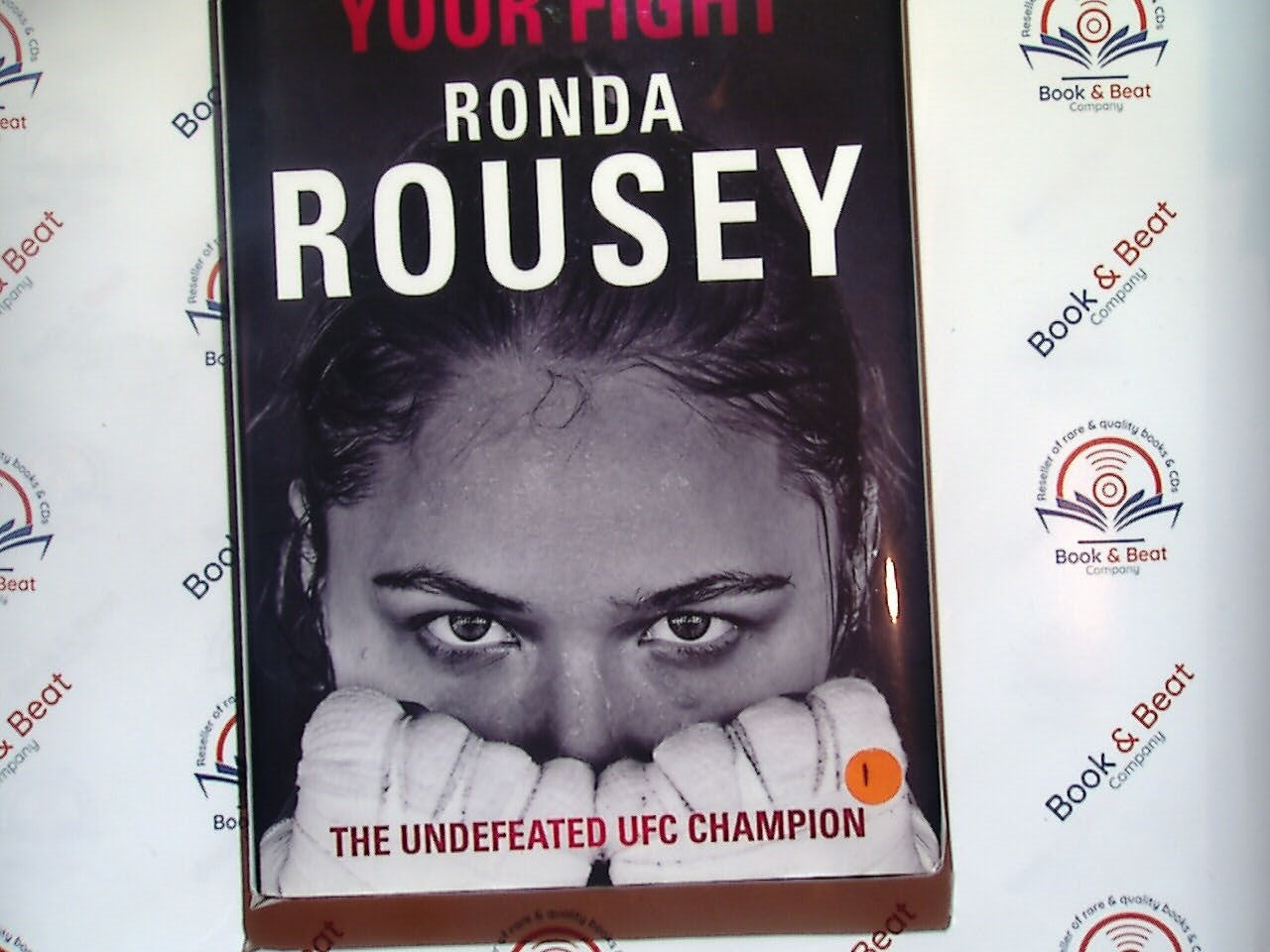Ronda Rousey, My Fight Your Fight, autobiography, MMA, mixed martial arts, sports biography, fighting career, Ronda Rousey memoir, women's sports, UFC champion, inspiration, female athlete, martial arts fighter, Bookandbeat.com, overcoming adversity, combat sports, personal journey, empowering women, sports memoir, UFC history, strength and resilience.